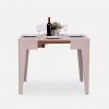Small grey wooden dining table with place settings for 4 people