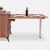 Wooden dresser with built-in table extension opened as a dining table for 4 people
